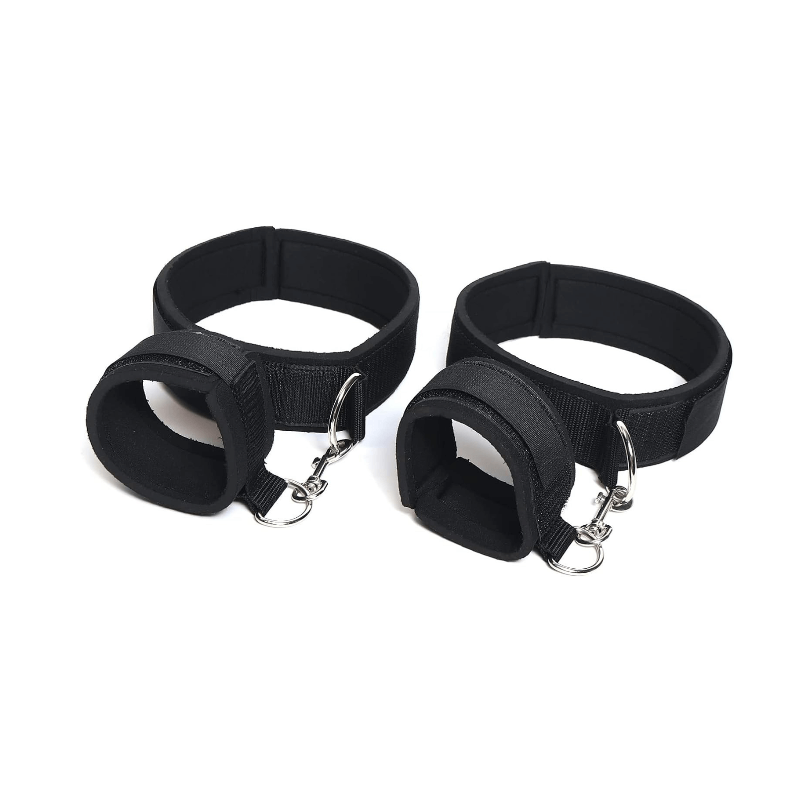 Wrist and thigh restraints set by Club69, padded black cuffs for versatile and seductive play.